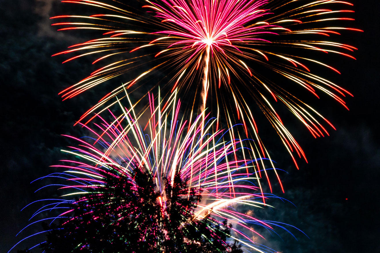 a photo showing a fireworks display against a night sky