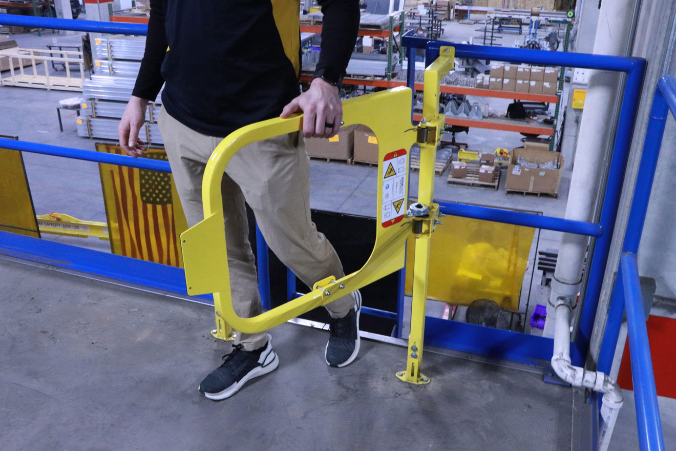 a photo of a worker entering an elevated workspace via a PS Industries safety access gate