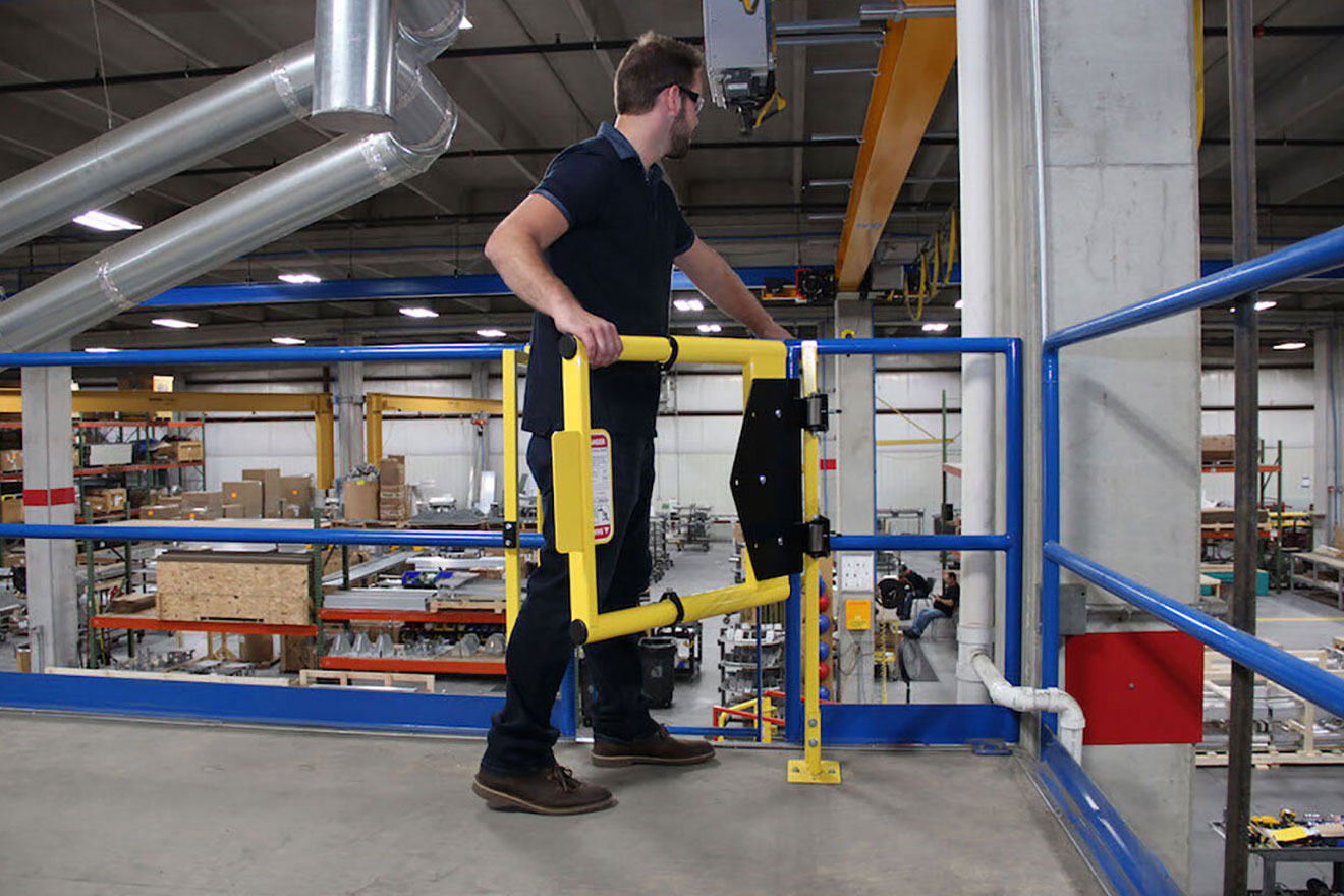a graphic showing a worker walking through an EdgeHalt Adjustable Safety Gate