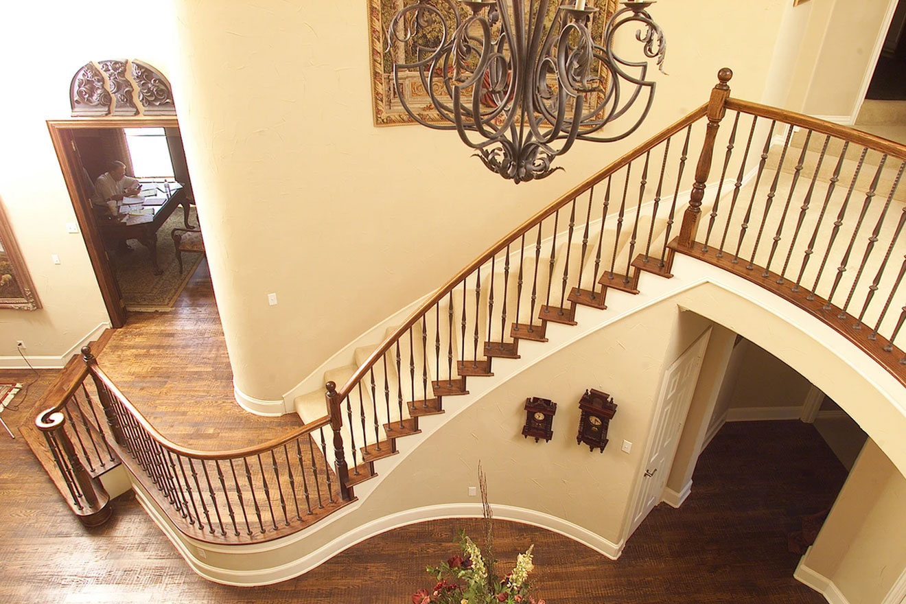 a photo collage showing various House of Forgings iron stair part collections