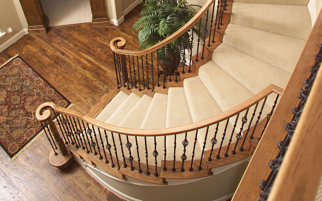 a photo of a grand entry staircase with Coffman iron stair parts